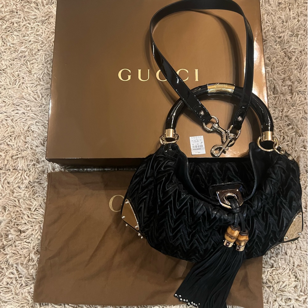 Black Gucci zig zag fur with black patent leather handle and tassel